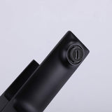 Close-up of aerator on matte black bathroom sink faucet for controlled water flow