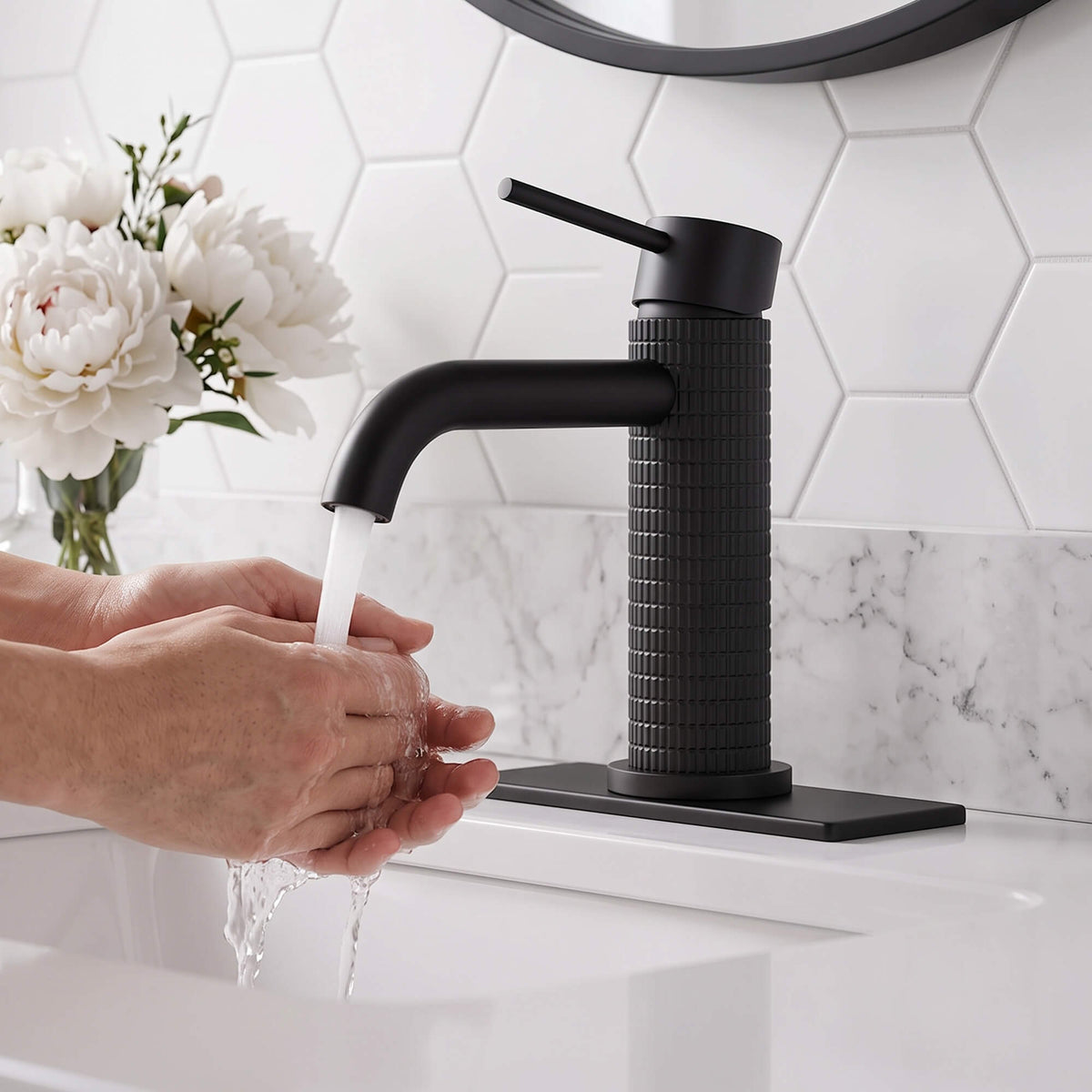Matte black bathroom faucet with hand washing water flow demonstration