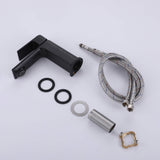 Matte black bathroom sink faucet with supply lines and mounting hardware