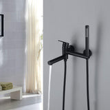 Matte black bathtub faucet dispensing water with a handheld shower beside it