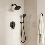 Wall-mounted black shower set featuring a round overhead head, multi-function hand shower and concealed diverter valve