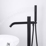 Handheld shower on matte black freestanding tub filler delivering a wide rinsing spray