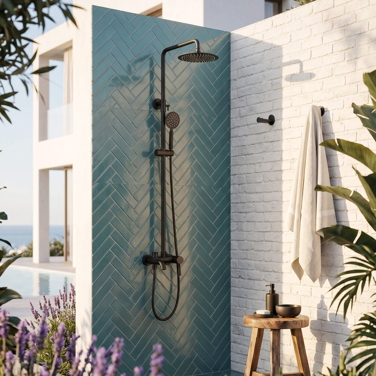 Matte black poolside outdoor shower with rainfall head, handheld shower, and tub spout for patio or garden use