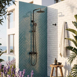 Matte black poolside outdoor shower with rainfall head, handheld shower, and tub spout for patio or garden use