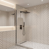 Matte black rain shower system installed in modern bathroom with wall mount shower head and handheld sprayer