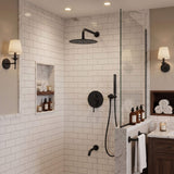 Matte black rain shower system with overhead shower, handheld shower and tub spout in a modern white tile bathroom