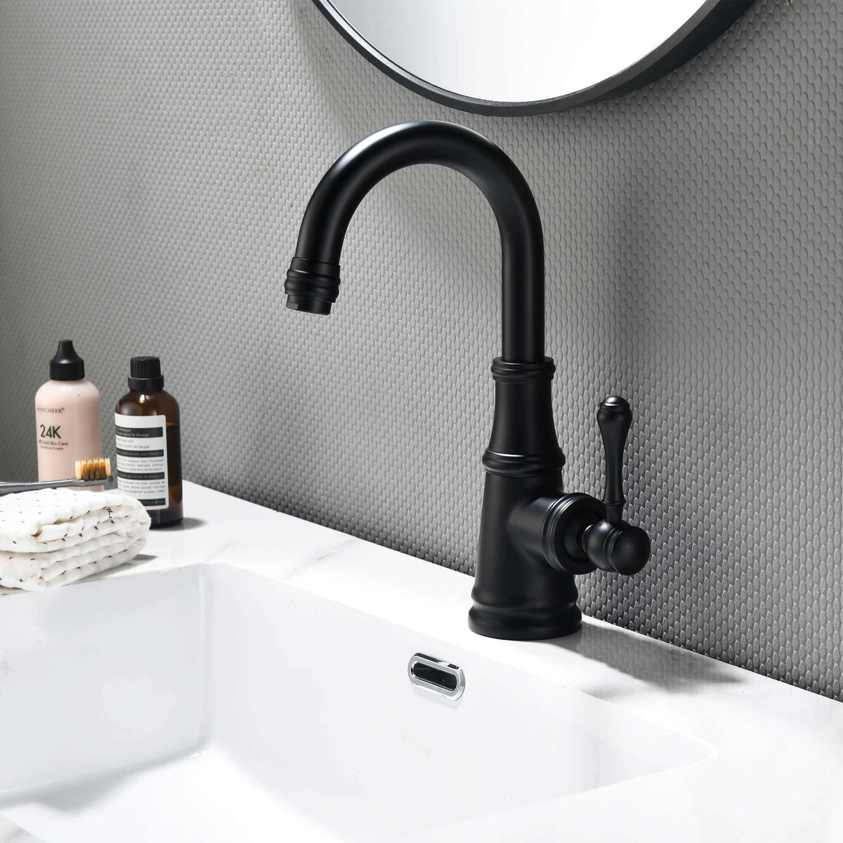 Matte black single handle bathroom sink faucet installed on modern bathroom vanity