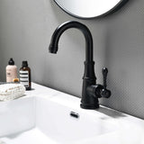 Matte black single handle bathroom sink faucet installed on modern bathroom vanity