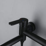 Close-up of single-handle matte black wall-mounted bathtub faucet control