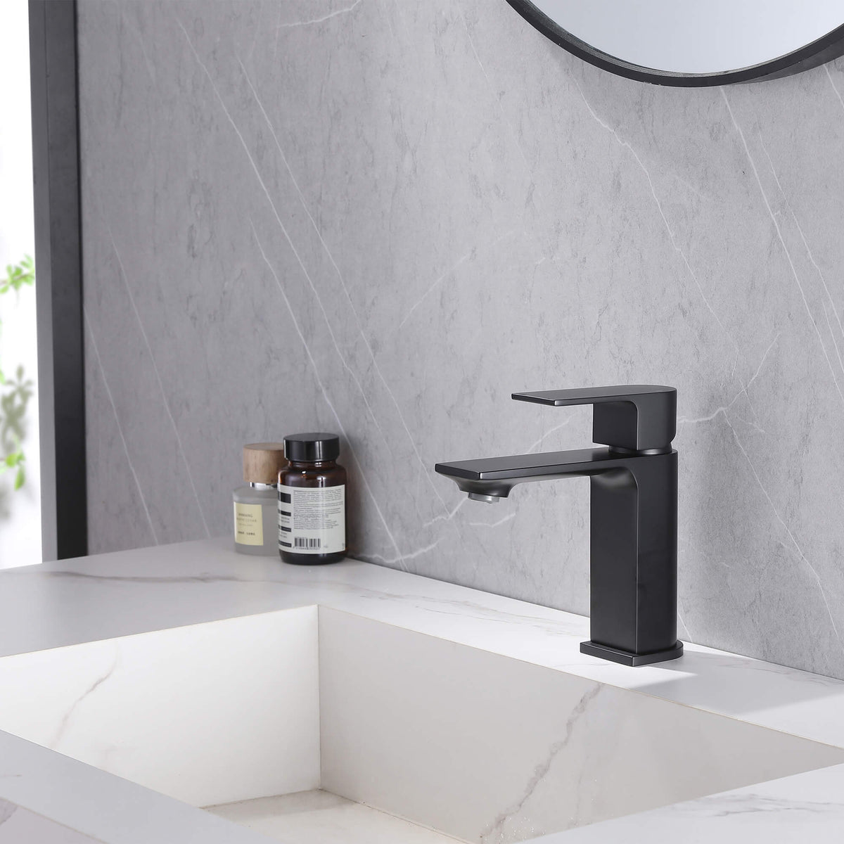Matte black square single-hole bathroom sink faucet installed on modern vanity