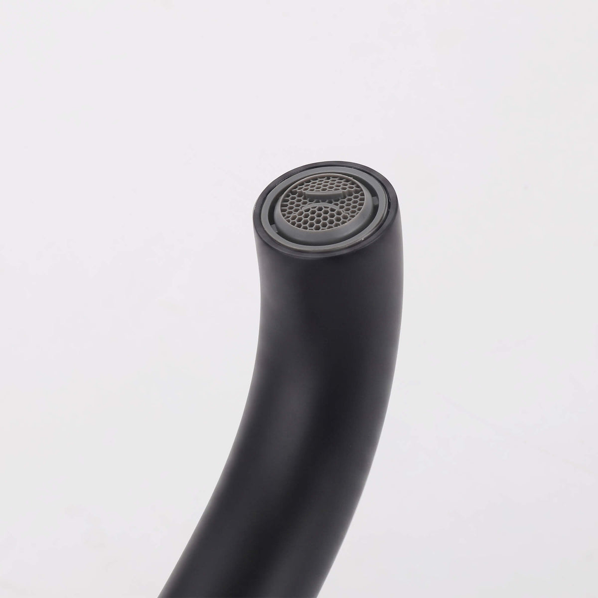 Close-up of matte black freestanding tub filler spout with built-in aerator