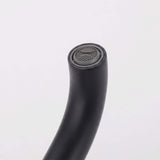 Close-up of matte black freestanding tub filler spout with built-in aerator