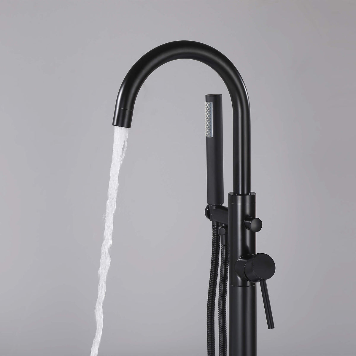 Matte black tub filler with handheld shower and curved bathtub spout
