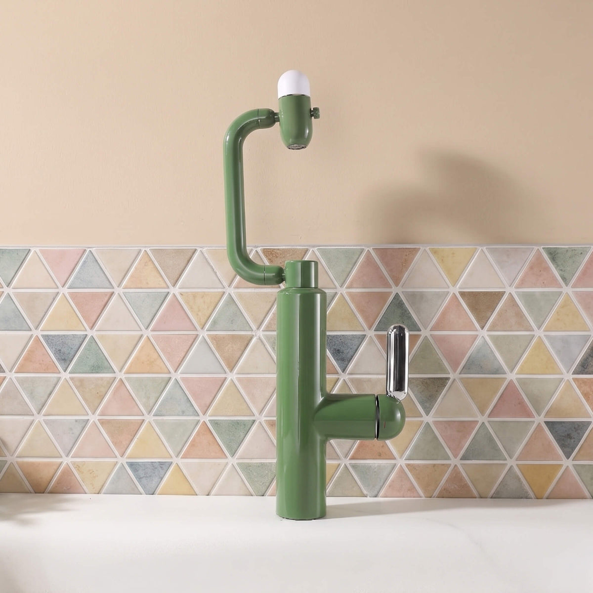 Olive green bathroom faucet installed in a colorful home bathroom setting