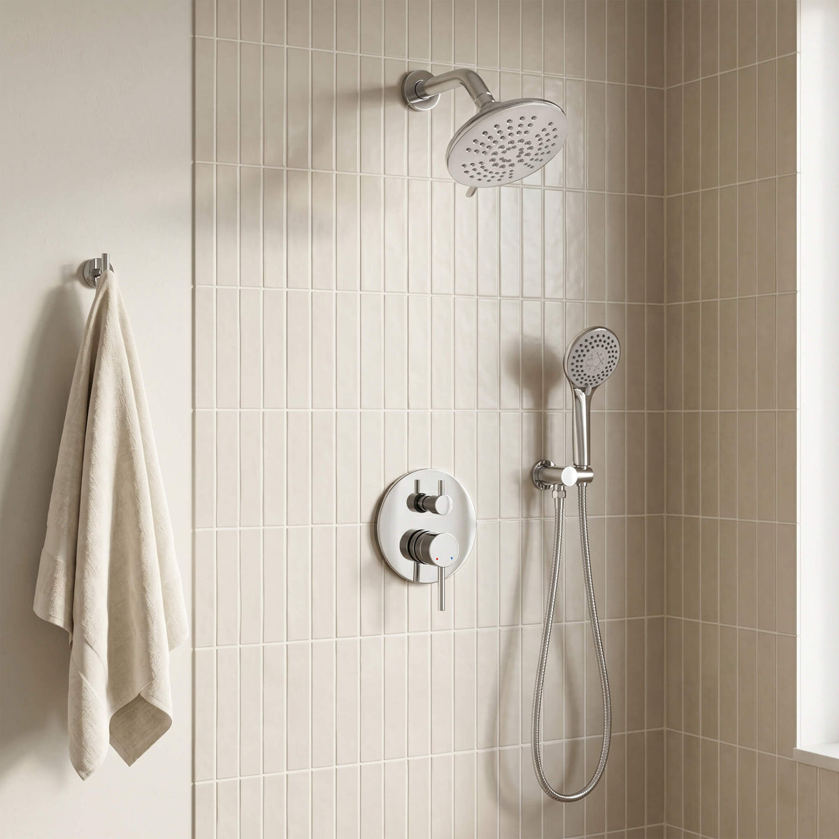 Modern wall-mounted shower set featuring a round overhead spray, matching hand shower and concealed dual-control valve