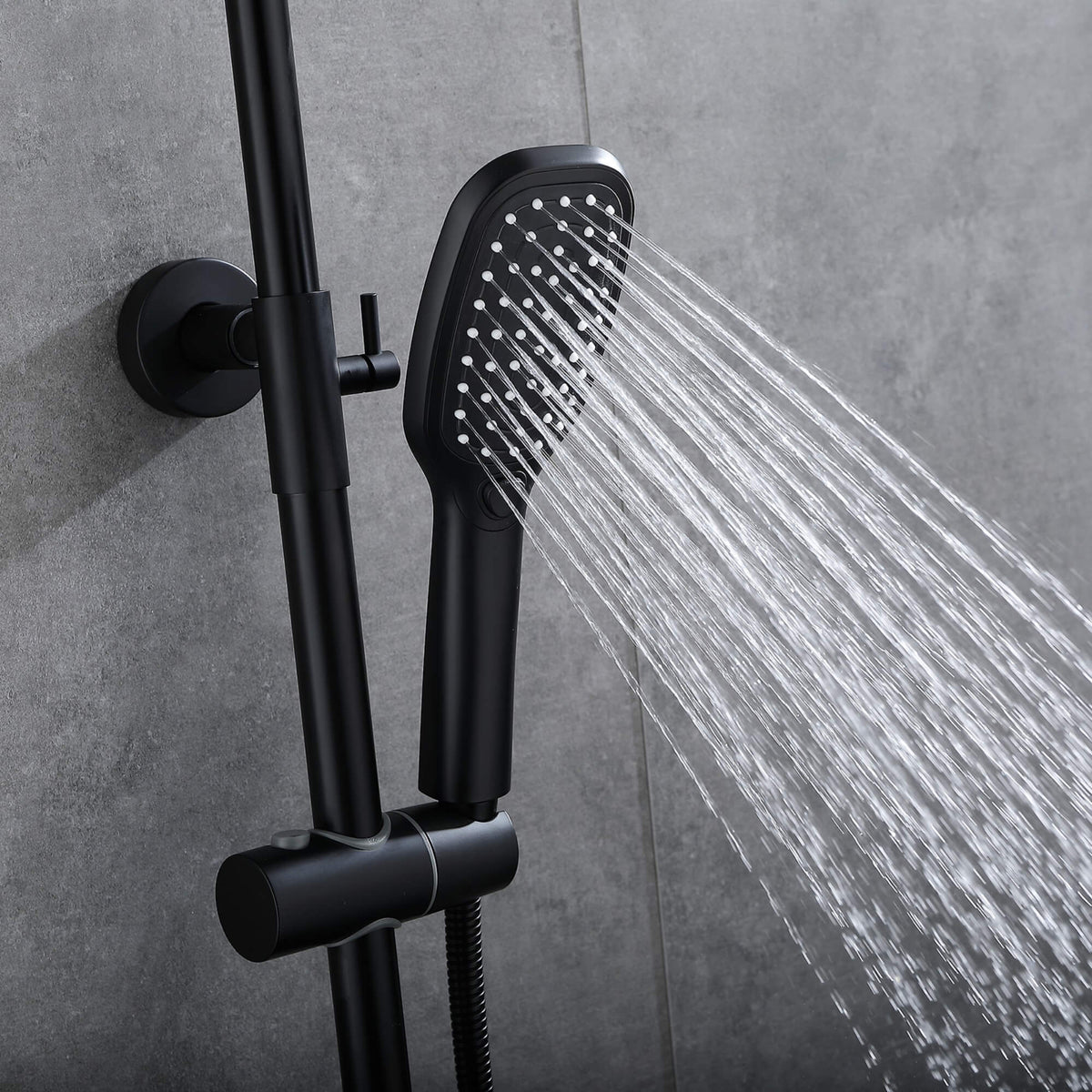 Matte black handheld shower head spraying water beside the adjustable shower rail