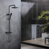 Matte black thermostatic shower system with square rainfall head and handheld shower in a modern bathroom