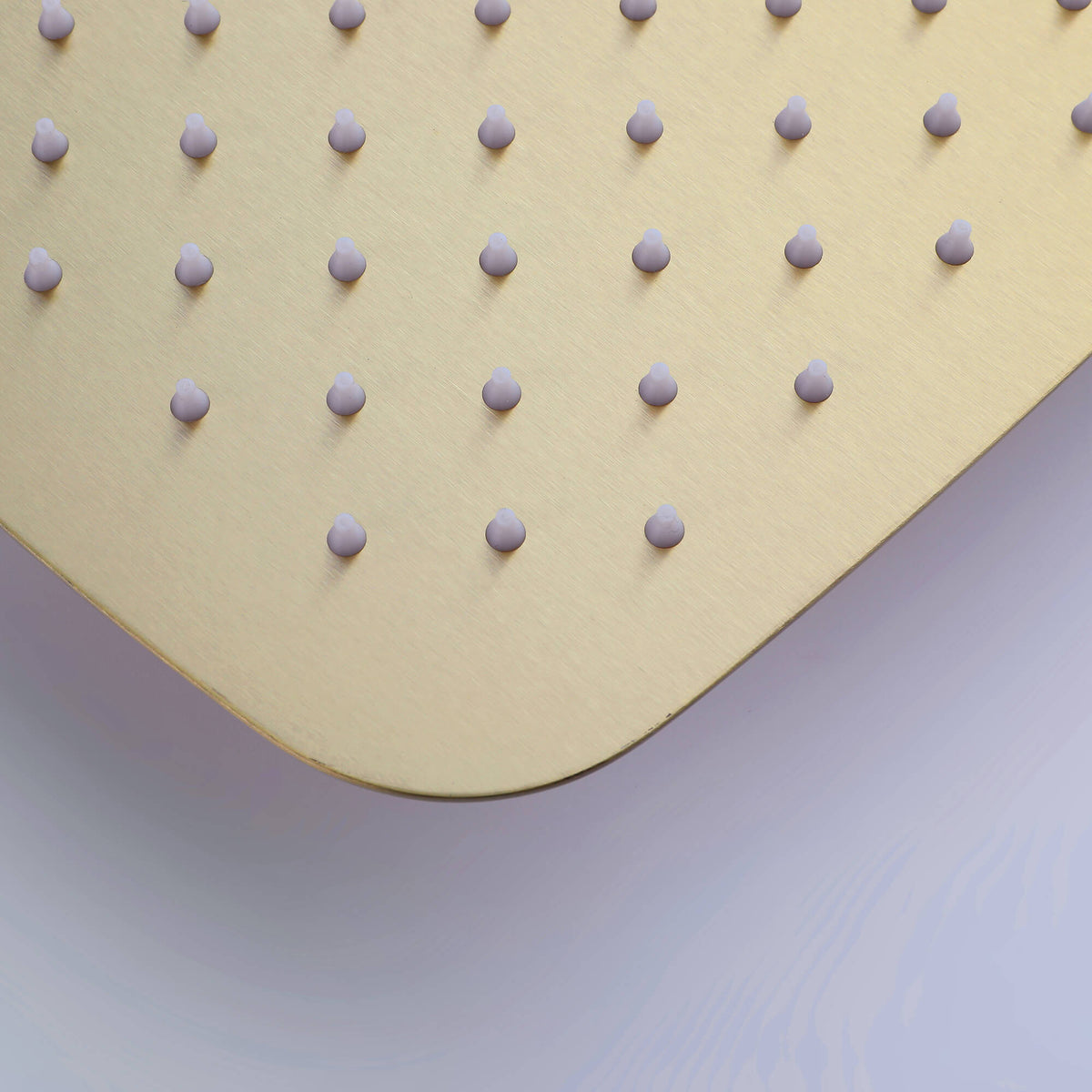 Close-up of silicone nozzles on brushed gold shower head, easy to clean and anti-clog design.