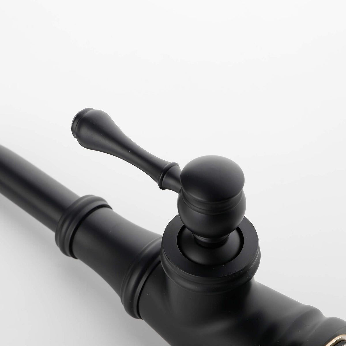Single handle bathroom faucet lever handle detail in matte black finish