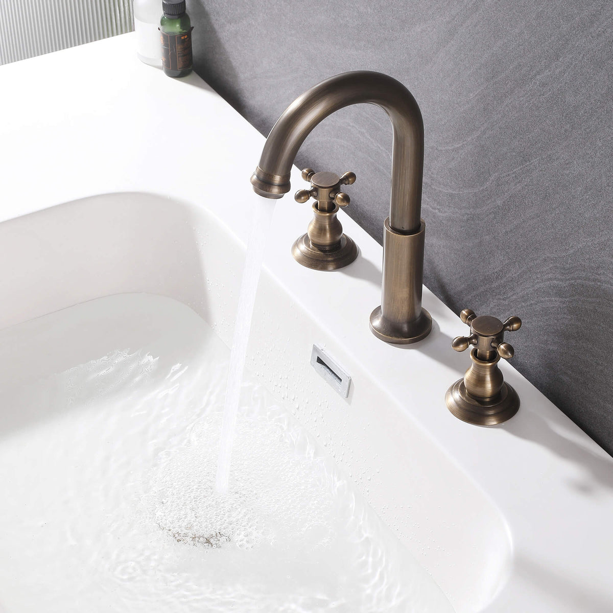 Tall arched spout bathroom faucet with separate cross handles in a vintage finish