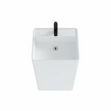 Top view of square freestanding pedestal sink in matte white with black faucet, showcasing clean minimalist basin design.