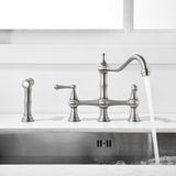 Two handle brushed nickel bridge kitchen faucet with side spray and running water