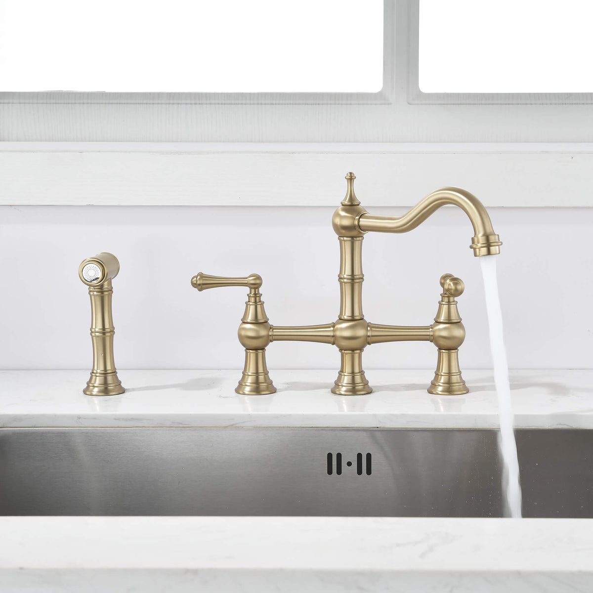 Two handle brushed gold bridge kitchen faucet with side spray and running water