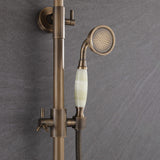 Vintage-style antique brass handheld shower with decorative light-colored handle