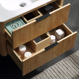 Wall-mounted bathroom vanity with open drawers viewed from above