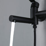 Close-up of matte black wall-mounted tub faucet spout with steady water flow
