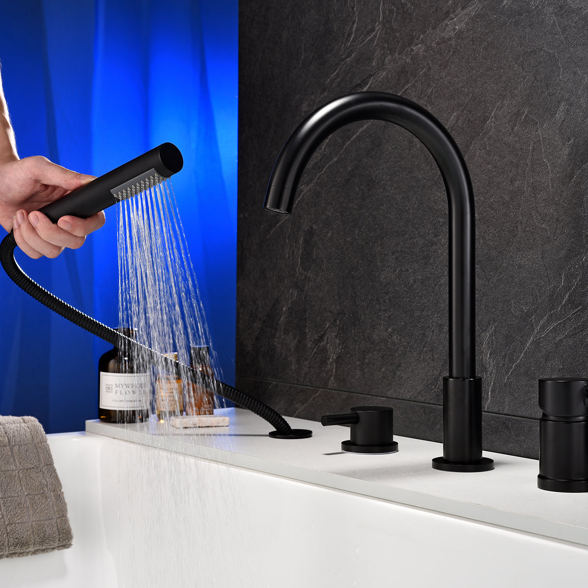 Deck-Mounted 4-Hole Tub Filler with Dual Handles and Handheld Shower